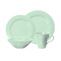 A mint green ceramic dinnerware set featuring two plates, a bowl, and a mug with concentric circular ribbed patterns, displayed on a clean white background.